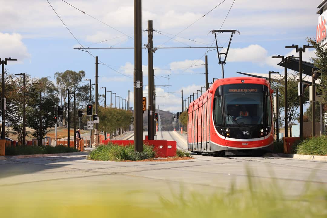 Canberra Metro light rail vehicle driving through Gungahlin area